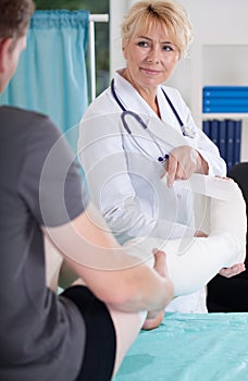 Man with leg in plaster cast