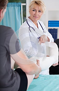 Man with leg in plaster cast photo
