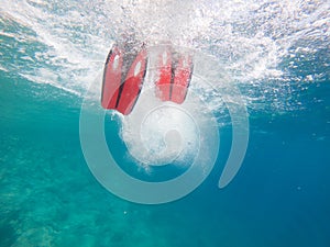 man legs in flippers underwater