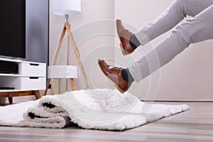 Man Legs Stumbling With A Carpet