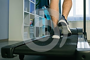 Man Legs Treadmill Running In Home. Cardio Run Workout
