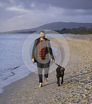 Man leisurely walking dog photo