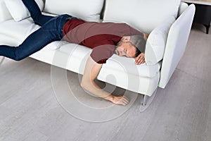 Man With Lethargy And Fatigue On Couch photo