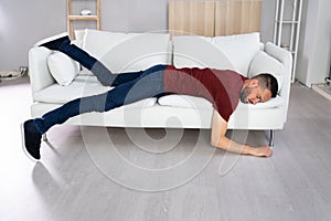 Man With Lethargy And Fatigue On Couch