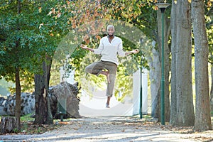 Man, levitate and meditation with yoga outdoor, portrait or exercise in park with health and healing. Spiritual, flying