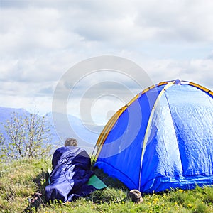 Man lie in sleeping bag