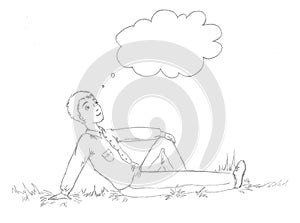 A man lies on the grass and thinking