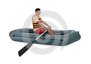 Man in life vest rowing inflatable rubber boat on white background