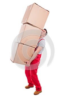 Man lifting bunch of heavy cardboard boxes
