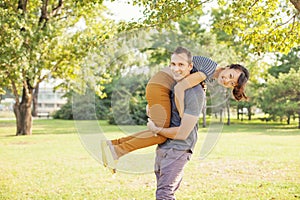 Man lifting his girlfriend