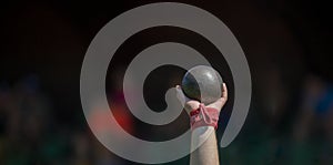Man Lifting Shot Put at a Track and Field Meet. Horizontal sport poster, greeting cards, headers, website
