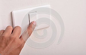 A man with a light switch