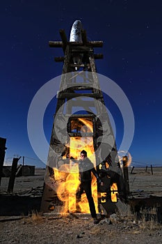 Man LightPainted With Fire in Industrial Setting