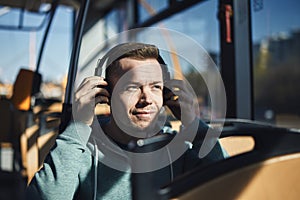 Man listening music while commuting by public transportation