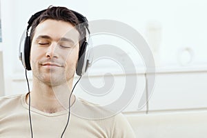 Man listening music with headphones