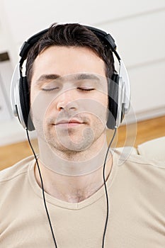 Man listening music with headphones