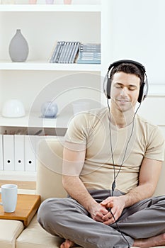 Man listening music with headphones