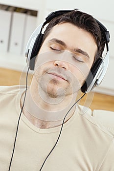 Man listening music with headphones