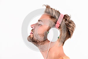 Man listening music headphones white background. Modern technology. Music taste concept. Enjoy perfect music sound