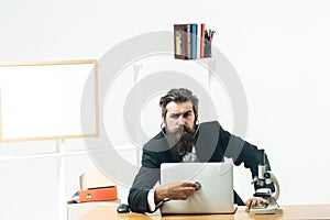 Man listening stethoscope laptop