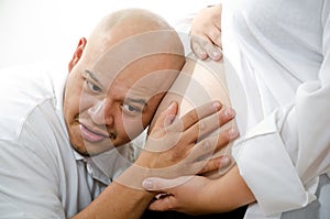 Man listening to baby