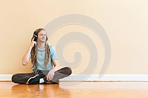 Man listening to headphones in a big room