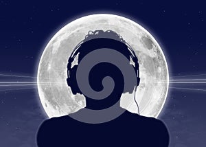 Man listening to the music at the full moon