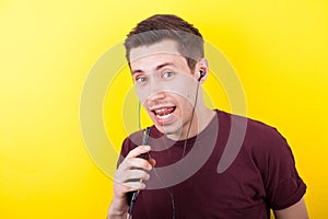 Man listening to music and singing