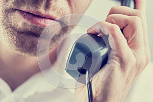 Man listening to a telephone conversation