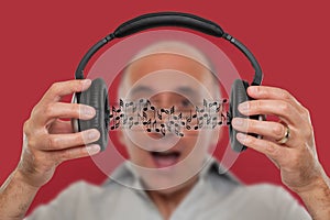 Man listening and visualizing music notes