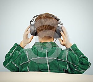 Man listens to symphonic music at home on couch photo