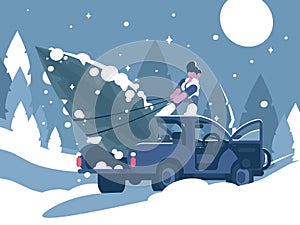 Man loading Christmas tree in car