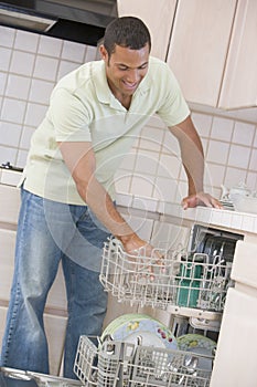 Man Loading Dishwasher