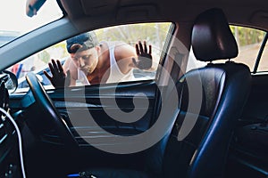 A man that is locked out of his car.