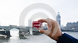 Man with a londoner red double-decker bus