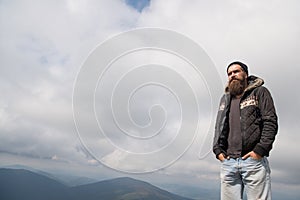 Man with long beard and mustache outdoor.