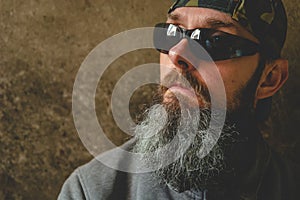 A man with a long beard wearing sunglasses