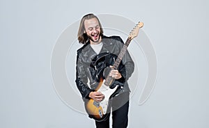 man long hair play electric guitar. rock music style. musician guitar player.