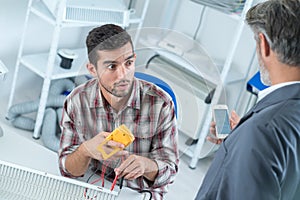 Man looking in amazement at mobile phone