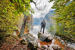 Man looking at Autumn Lake