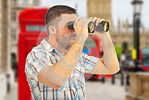 Man looking through binocular
