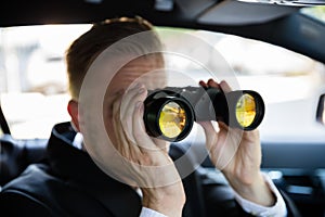 Man Looking Through Binocular