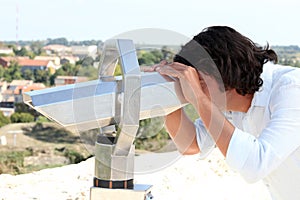 Man looking through binoculars