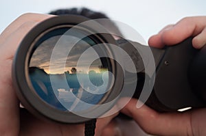 Man looking through binoculars