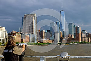 Man looking through binoculars in New York city Manhattan