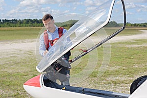 Man looking at cab sailplane