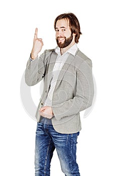 man looking at camera and pointing finger up. image isolated over white background. people, male, business and portrait concept