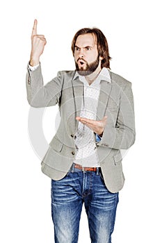 man looking at camera and pointing finger up. image isolated over white background. people, male, business and portrait concept