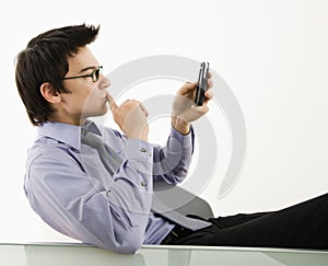 Man looking at cell phone.