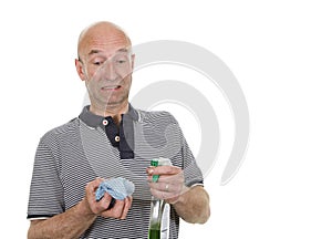 Man looking at cleaning cloth